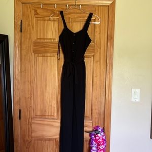 black button down jumpsuit with smocked back and tie!